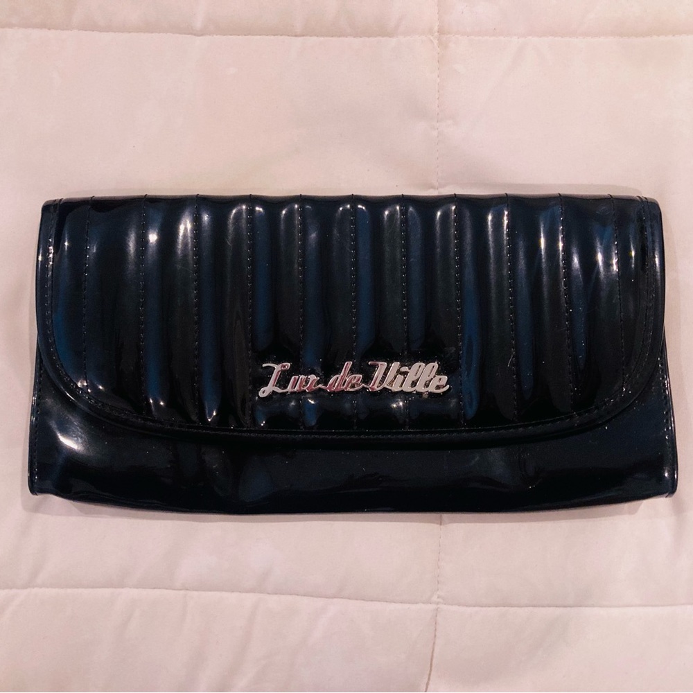 Lux De Ville black tuck n roll clutch